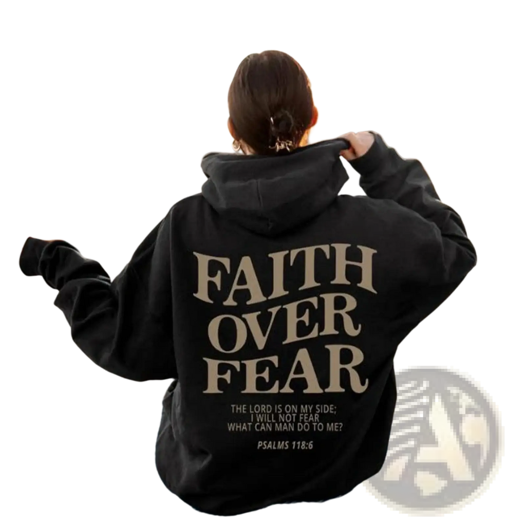 Black hoodie with beige faith over fear psalm 118:6 print on the back featuring a biblical verse in christian aesthetic style