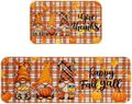 Orange and white plaid fall kitchen mat with three cartoon gnomes and autumn-themed accessories for thanksgiving
