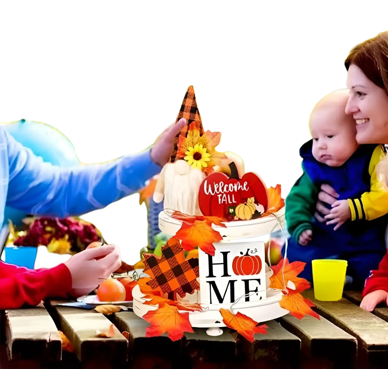 A white two-tiered fall tiered tray decor set featuring a gnome with an orange and black plaid hat surrounded by autumn leaves and pumpkins