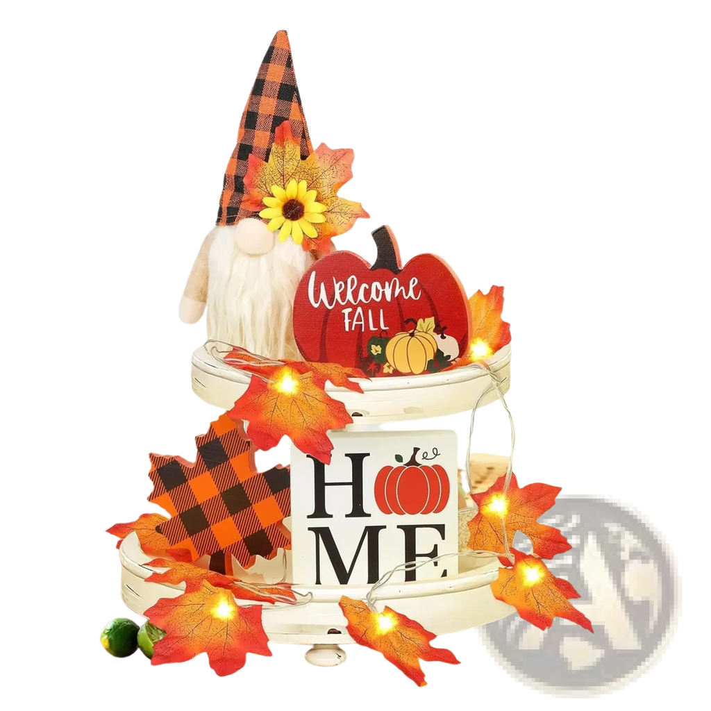 Fall tiered tray decor set featuring a white wood home sign, orange pumpkin, gnome with plaid hat, and autumn leaves with lights