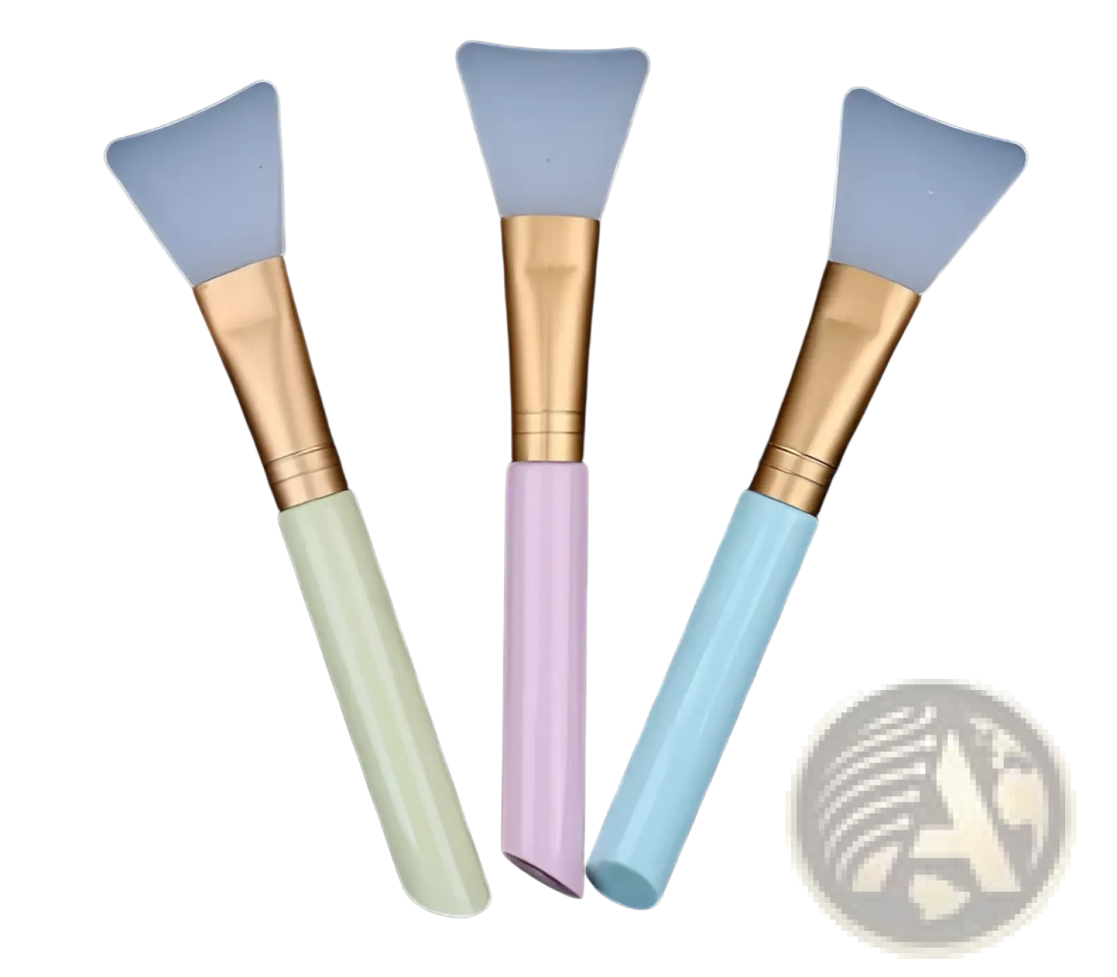 Set of three pastel-colored silicone facial mask applicator brushes with gold-toned metal ferrules and iridescent handles