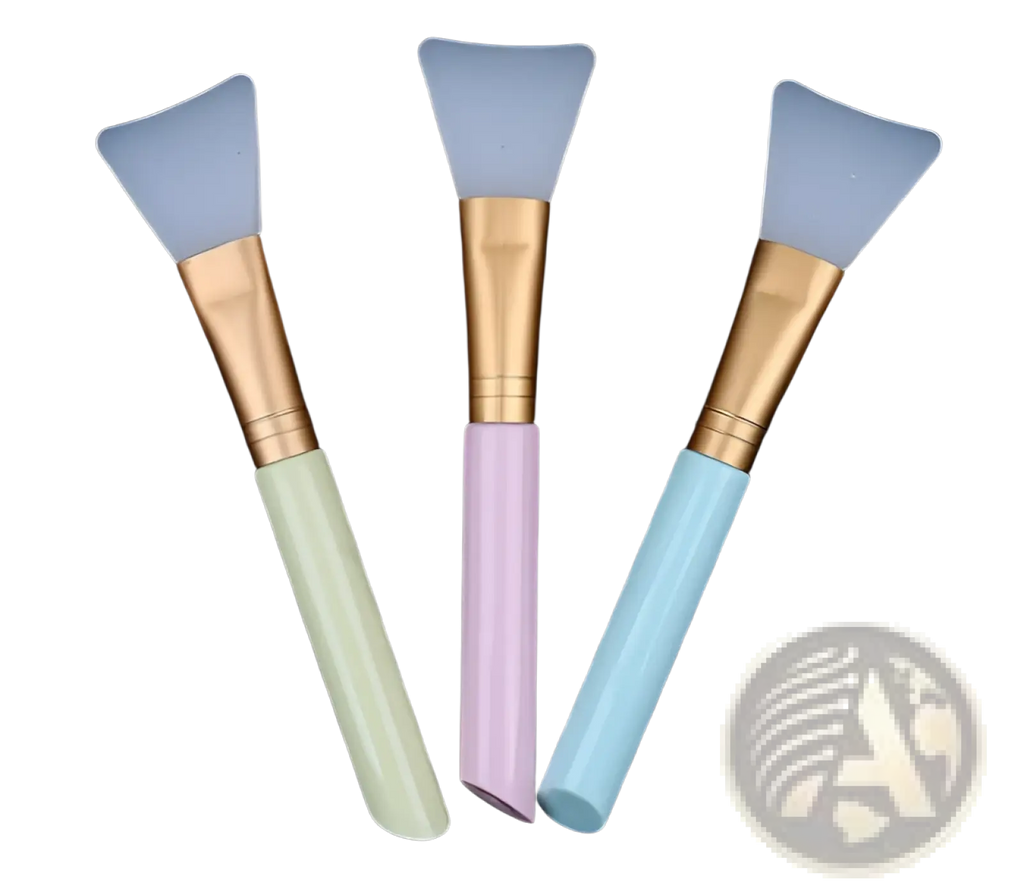 Set of three pastel-colored silicone facial mask applicator brushes with gold-toned metal ferrules and iridescent handles