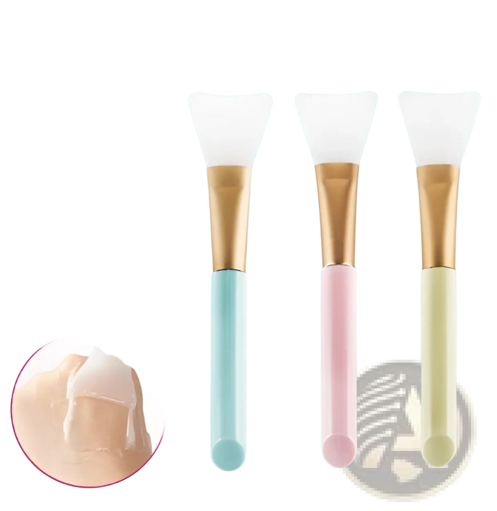 Set of three pastel-colored silicone facial mask applicators with gold-toned iridescent gradient metal handles for makeup application