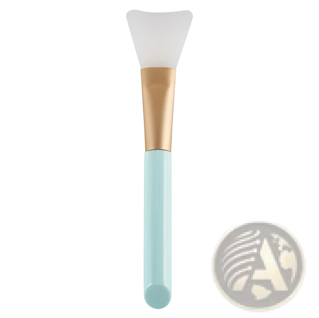 A mint green and gold facial mask applicator with a soft translucent silicone head from fan makeup brush set iridescent gradient handle 3pc