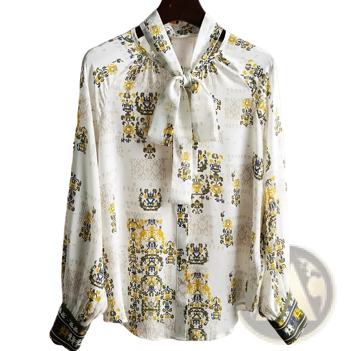 A white fanieces vintage print long sleeve bow blouse with yellow and navy blue heraldic pattern and tie neck design