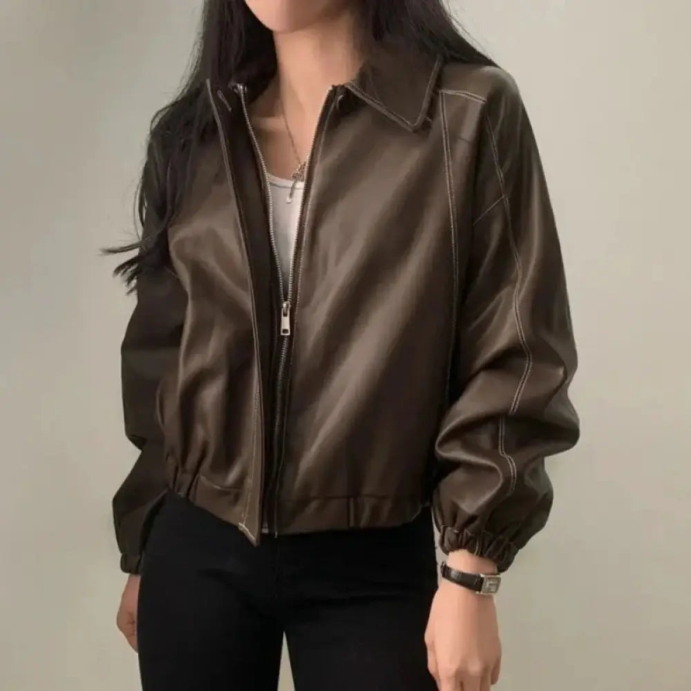 Black faux leather bomber jacket with contrast white stitching and elasticated cuffs in sleek dark brown