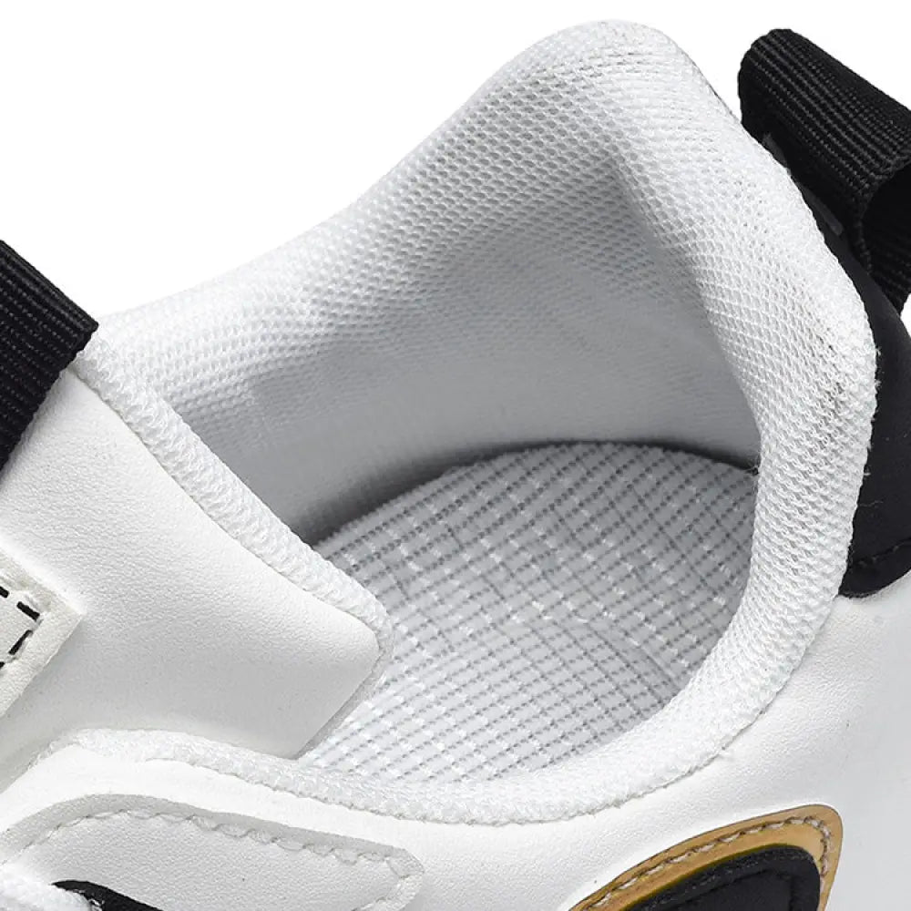 Men’s colorblock breathable mesh sport sneakers in white with black accents and a breathable mesh lining