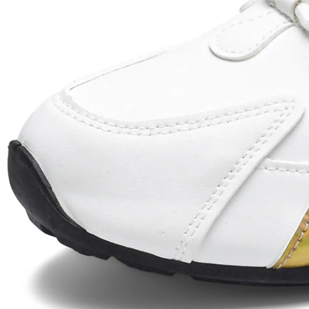 Men’s colorblock breathable mesh sport sneakers in white with glossy finish black toe cap sole edge and gold stitching