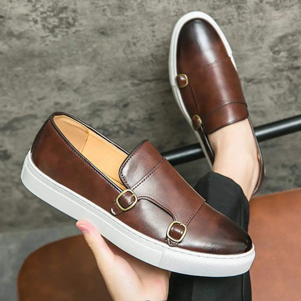 Men’s double monk strap leather fashion loafers in brown with gold-tone buckles and white rubber sole slip-on design