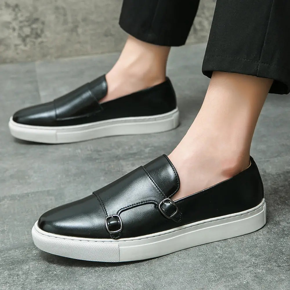 Men’s double monk strap leather fashion loafers in black with white rubber sole and two buckles on the vamp