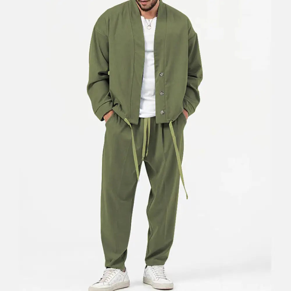 Men’s olive green slim fit casual blazer with matching drawstring pants and white sneakers for smart business wear