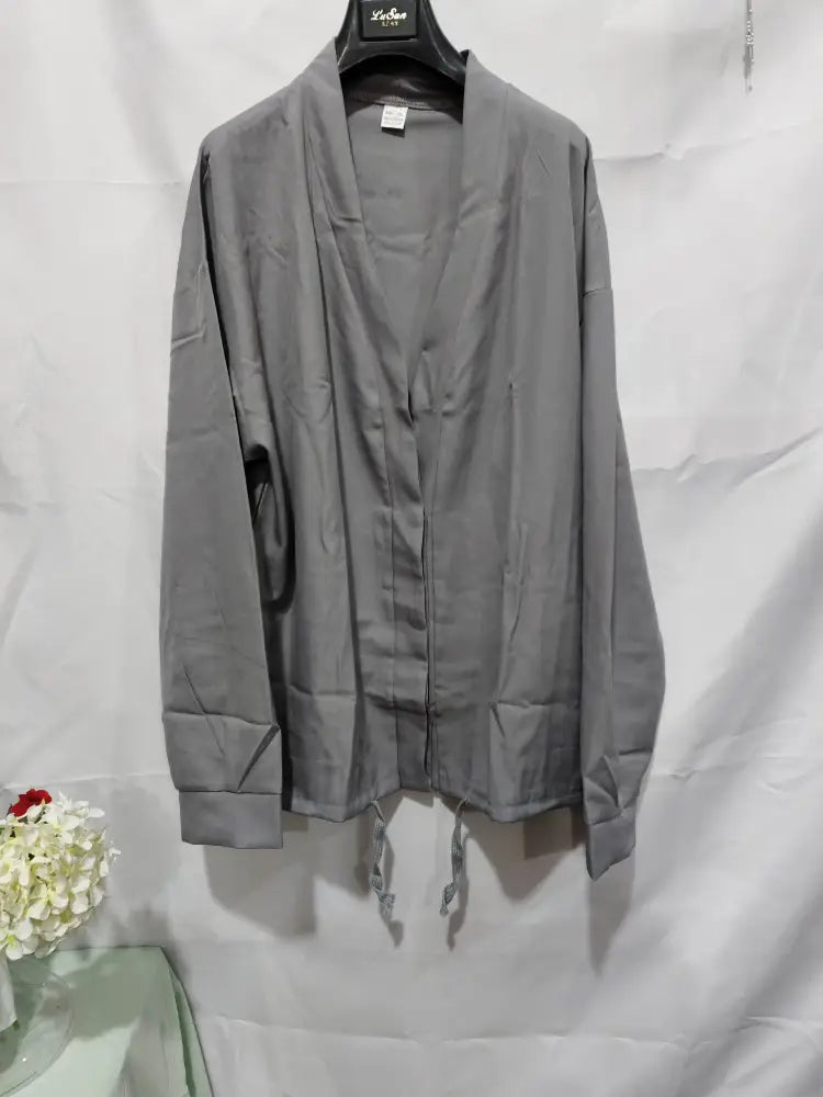 Men’s gray slim fit long-sleeved cardigan with v-neck front zipper and drawstring hem for smart casual business wear