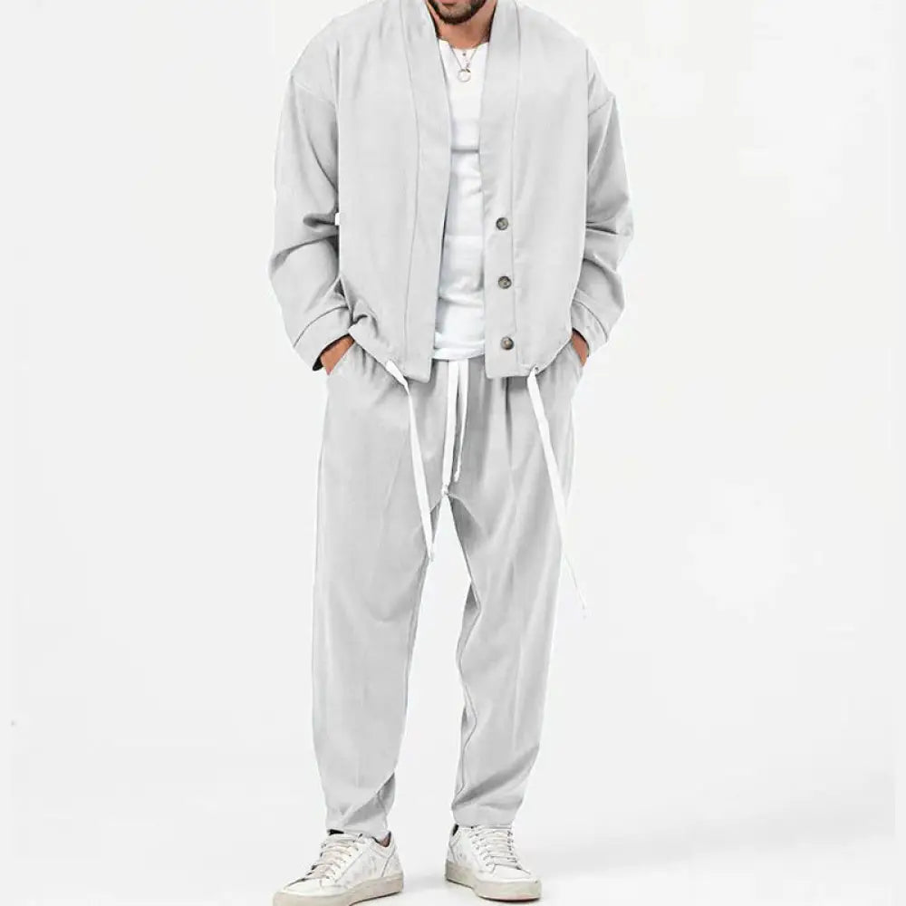 Men’s light gray relaxed-fit cardigan with button closure and drawstring waist complementing smart casual business attire