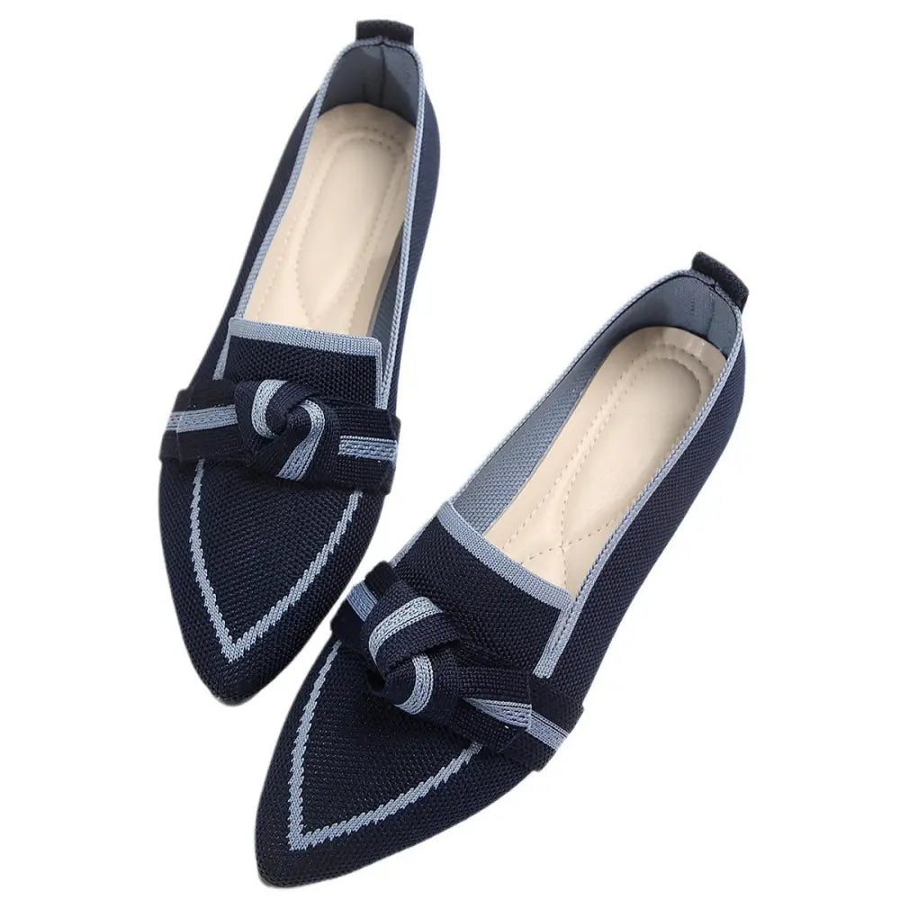 Navy blue knitted loafers with light gray woven accents and a decorative knot detail at the toe for summer wear