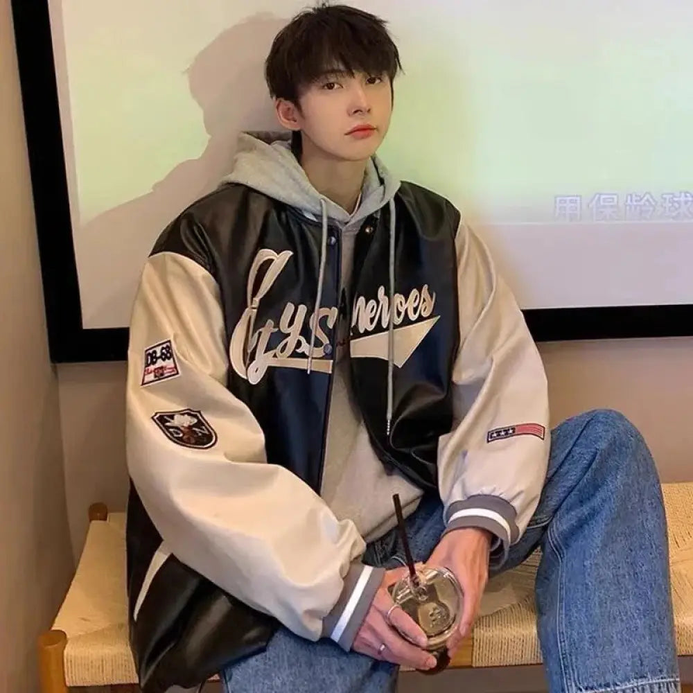 Men’s black and cream two-tone pu leather baseball bomber jacket with embroidered cys heroes lettering across chest