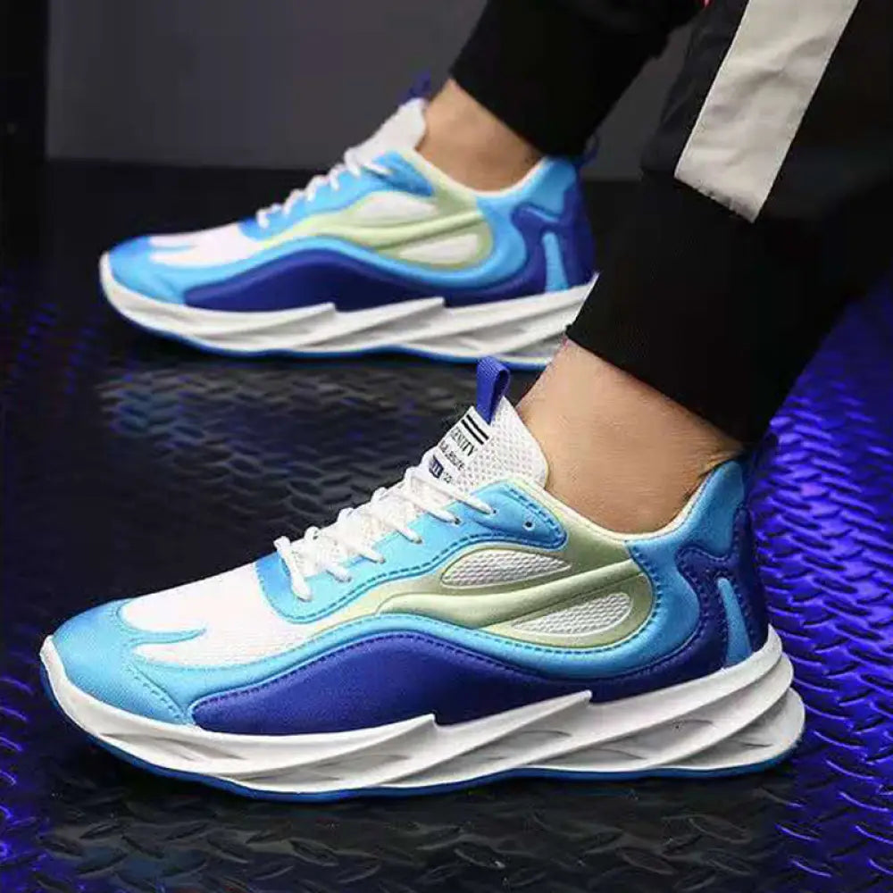 Men modern mesh non slip athletic running sneakers in blue and white with sleek design and bold wave pattern on upper