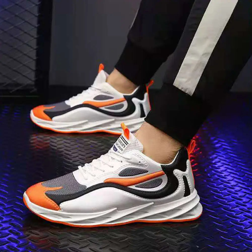 Men modern mesh non slip athletic running sneakers in white gray and orange with bold color accents and mesh panels