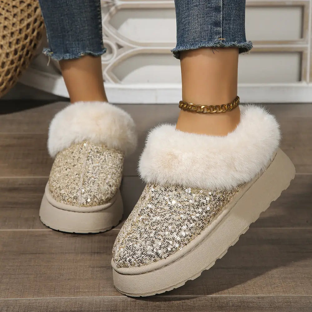Glittery silver sequined slip-on mules with plush white faux fur trim and chunky beige sole for winter wear