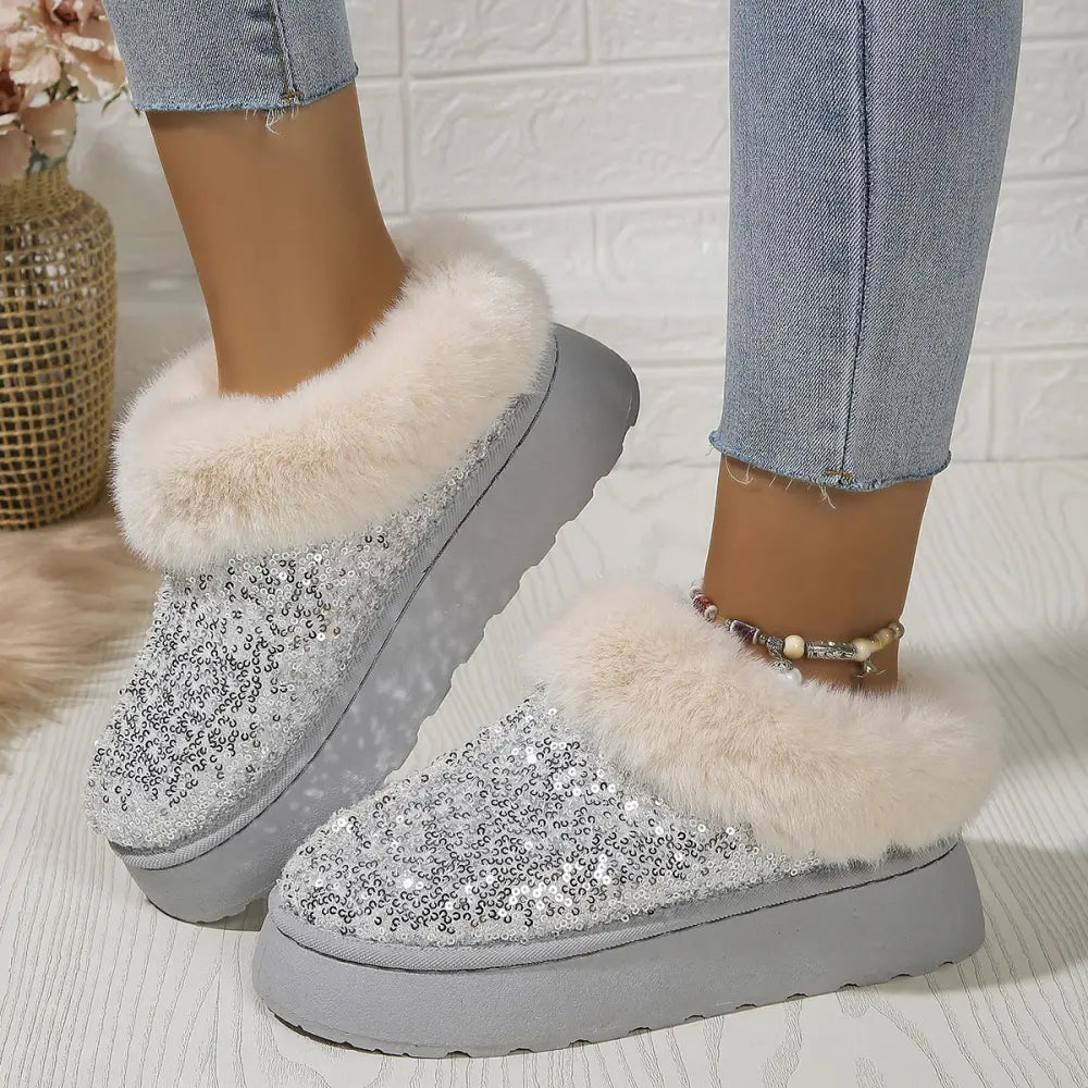 Women’s sequined plush winter platform slippers in silver with white faux fur trim and chunky gray sole