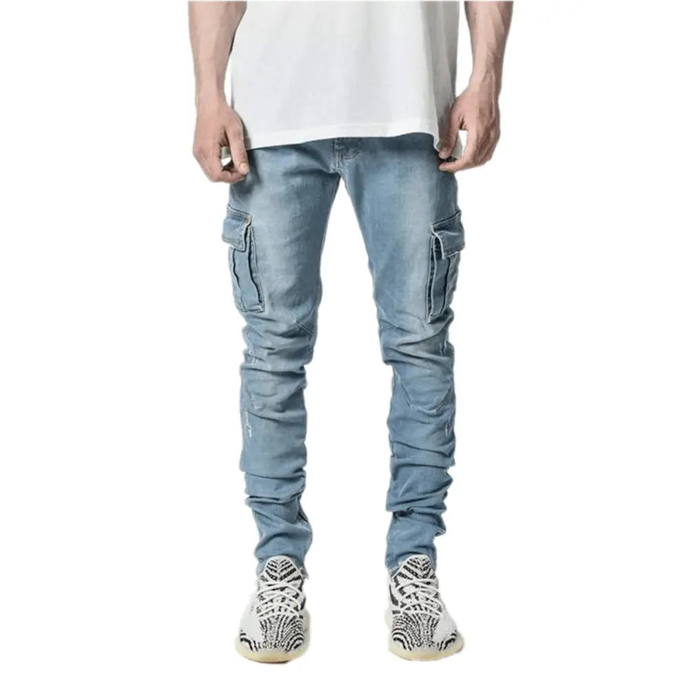 Slim fit distressed light-wash denim cargo jeans with prominent side pockets and a tapered silhouette