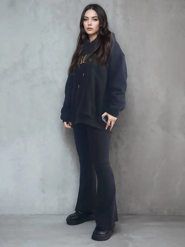Black oversized premium cotton unisex embroidered streetwear hoodie with gold lettering across the chest