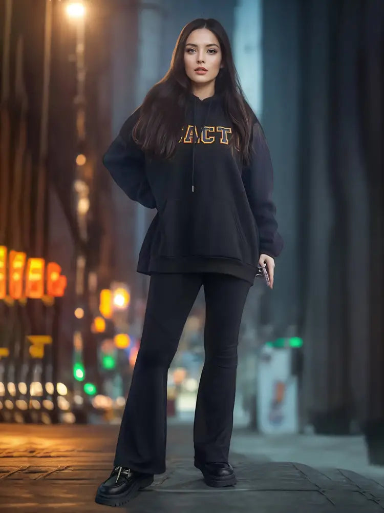 Black oversized premium cotton unisex streetwear hoodie with act embroidered in gold lettering on the chest
