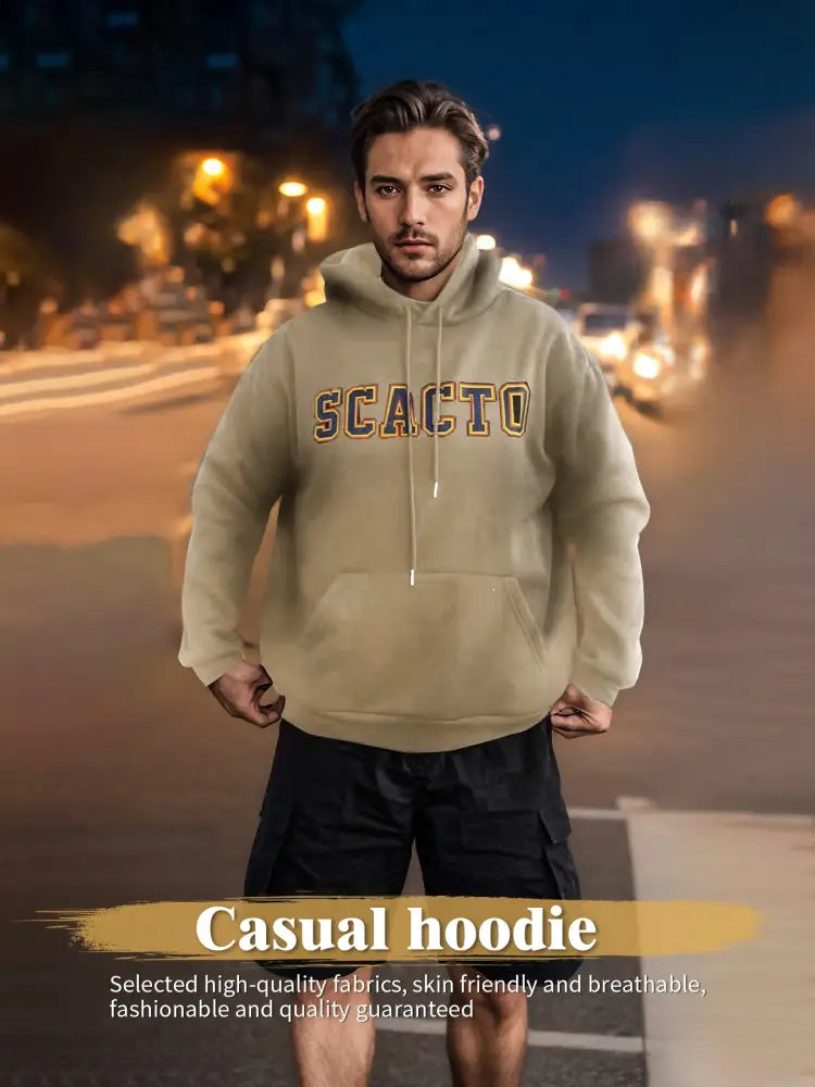 Beige premium cotton unisex embroidered streetwear hoodie with gold and black lettering across the chest