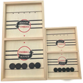Fast Sling Puck Game wooden foosball winner board with light wood frame and black circular player pieces on surface