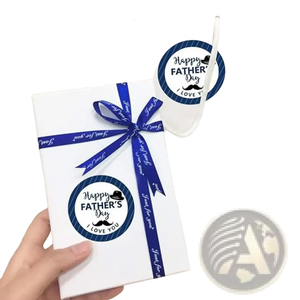 White gift box with a blue ribbon and circular happy fathers day stickers from fathers day gift stickers roll
