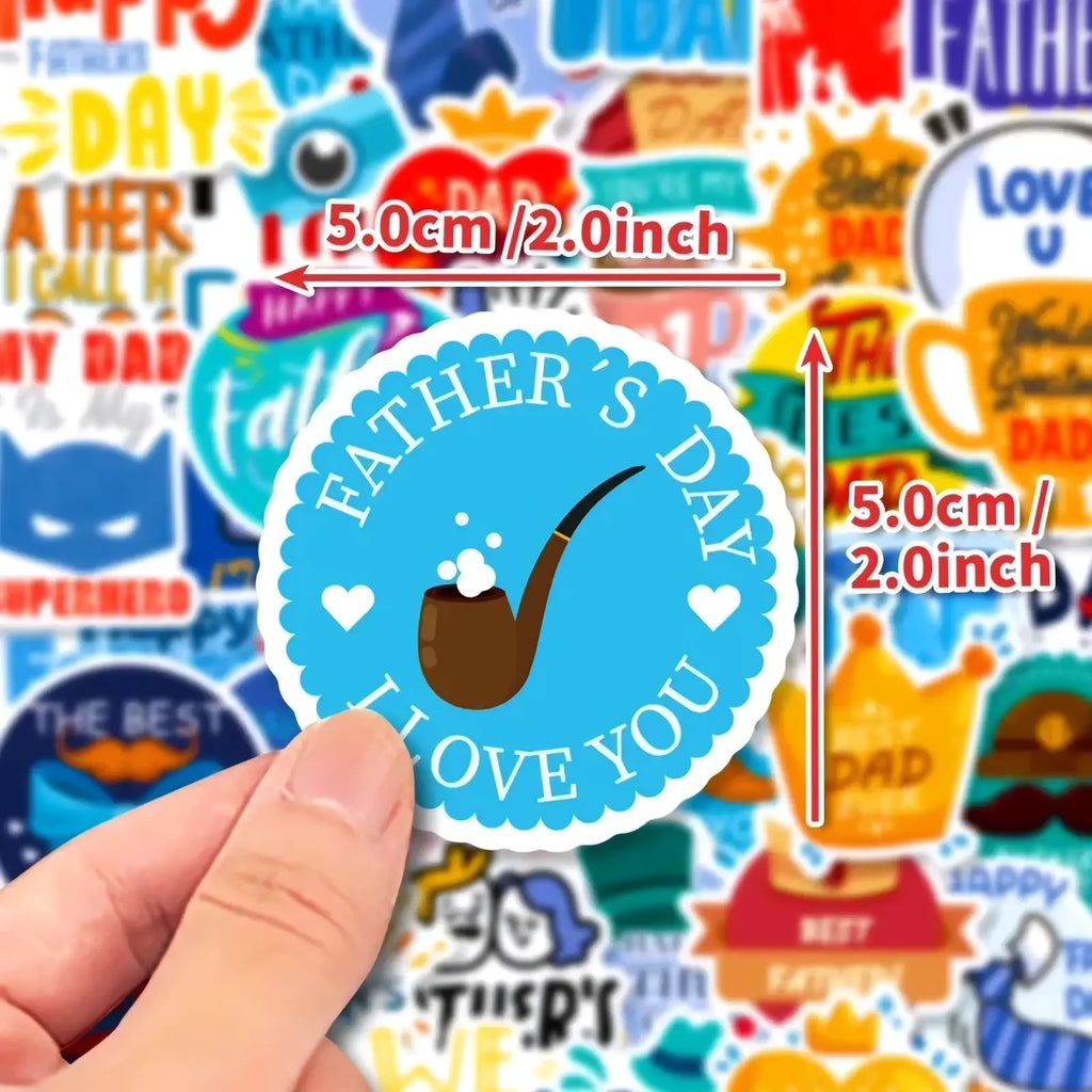 A circular blue father’s day sticker with a brown pipe design and white heart accents measuring 5.0cm diameter