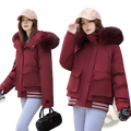 A maroon faux fur collar puffer jacket with a plush burgundy fur-lined hood and striped cuffs