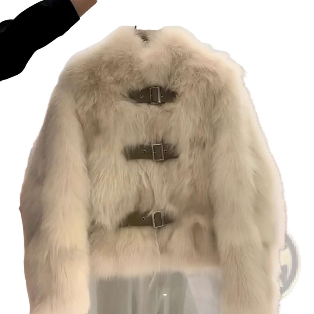 Cream-colored faux fur coat with three horizontal leather buckle straps across the front for stylish warmth
