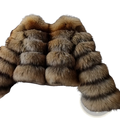 A luxurious faux fur cropped winter coat with layered fox fur in rich golden-brown and tan tones