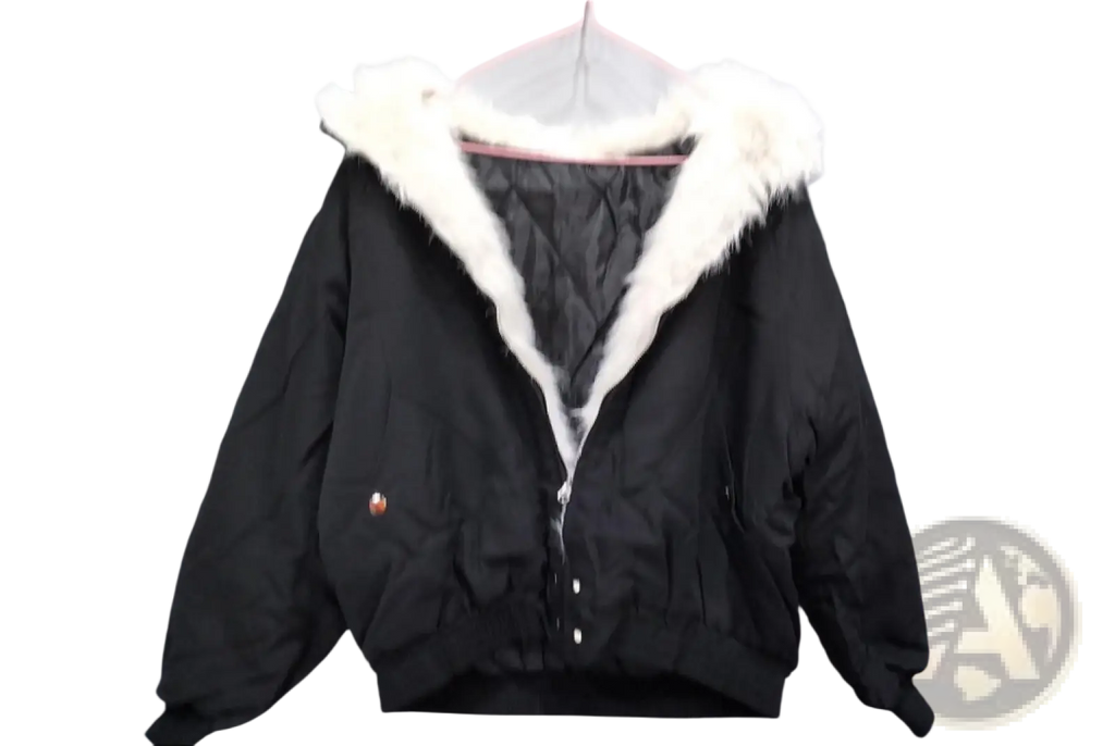 Black faux fur lined hooded winter bomber jacket with white fur-lined hood and quilted interior for cold weather