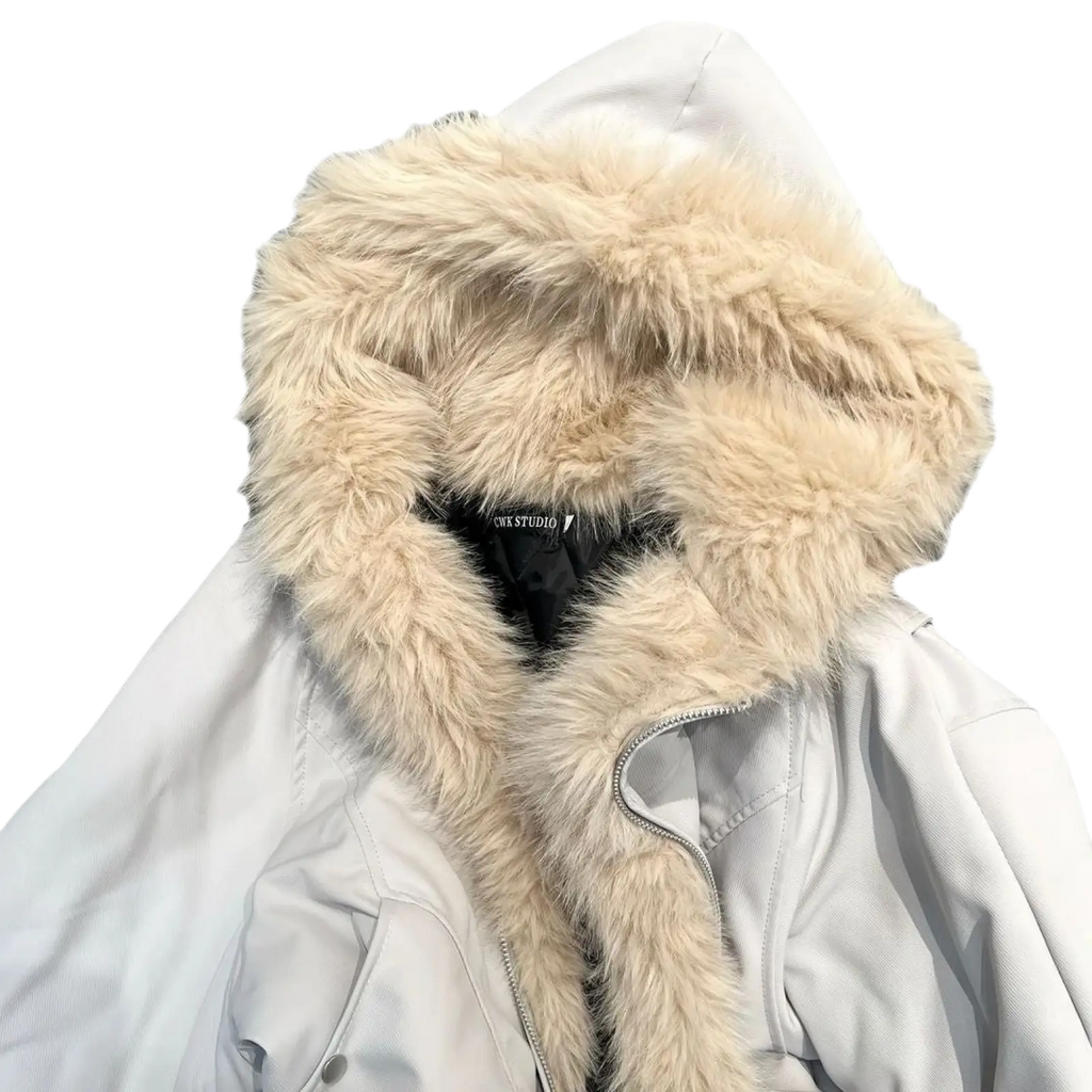 Faux fur lined hooded winter bomber jacket with cream-colored fur, white outer shell, and black inner lining
