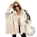 Faux fur short stand collar coat in cream with black striped sleeves and embroidered logos on the cuffs