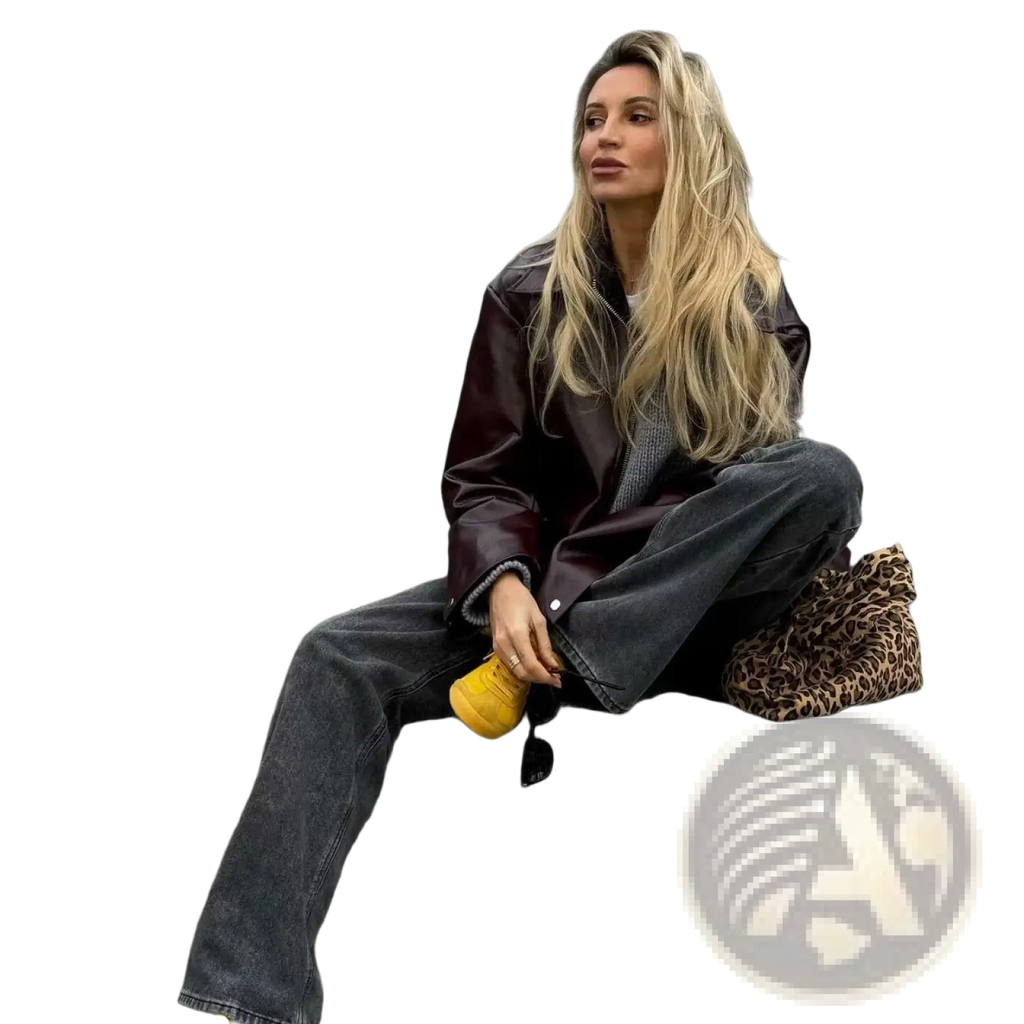 A leopard-print handbag with textured faux-leather finish and stitching details paired with a cropped moto coat