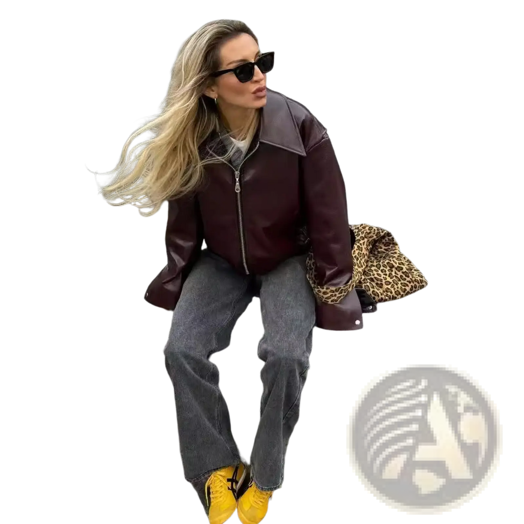 A maroon faux leather bomber jacket with a zipper front and structured collar in a loose fit cropped moto style