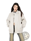 Beige faux leather bomber jacket oversized with a relaxed fit and subtle stitching details for casual wear