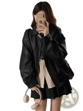 Black faux leather bomber jacket oversized short coat with relaxed fit and subtle stitching details