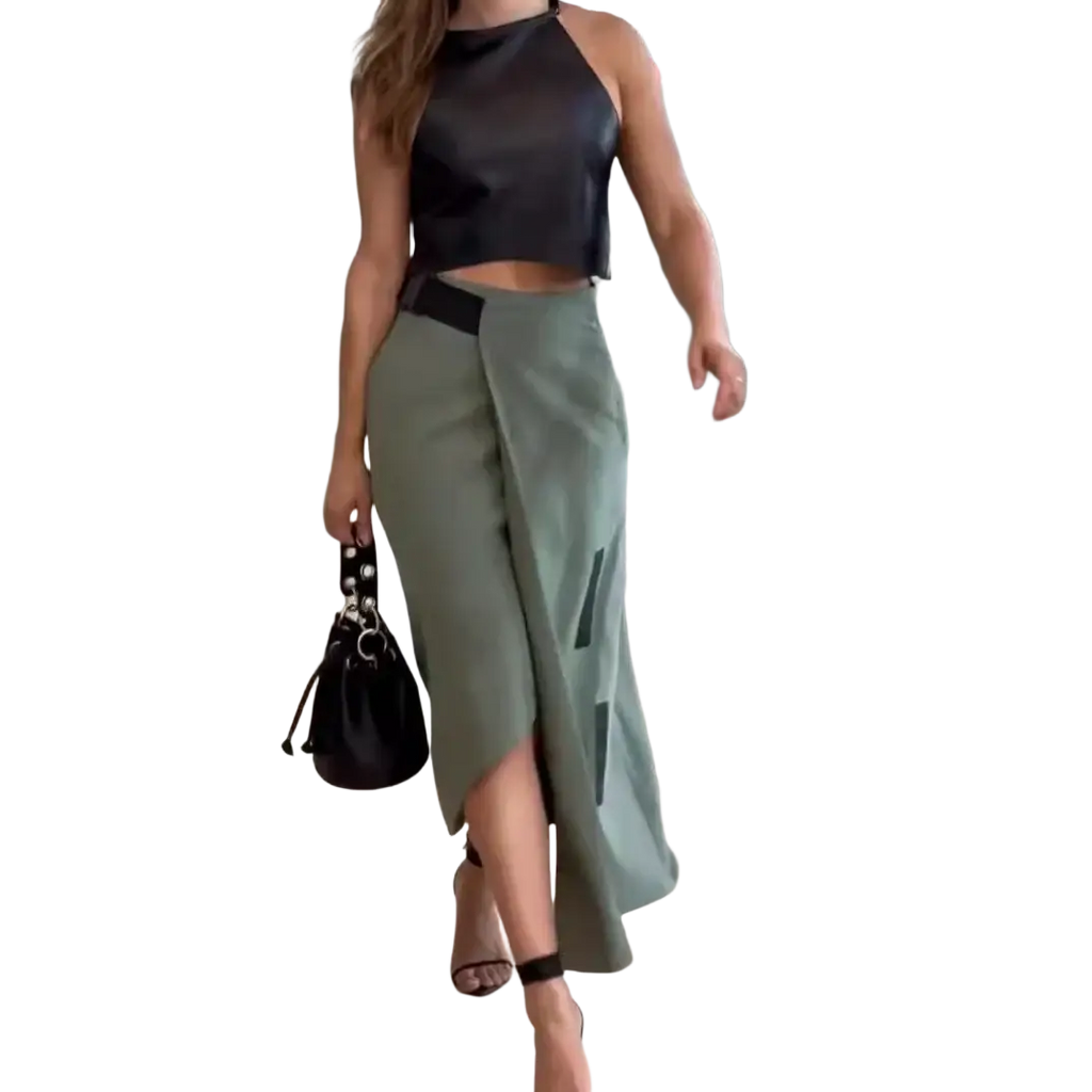 Black leather bucket bag with silver-toned hardware and drawstring closure featured with faux leather crop top and skirt set