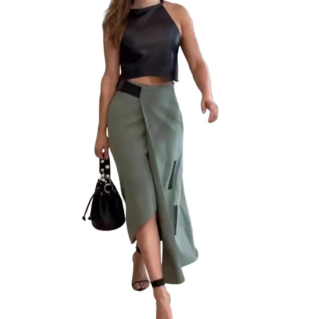Black leather bucket bag with silver-toned hardware and drawstring closure featured with faux leather crop top and skirt set