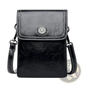 Black faux leather crossbody phone bag with silver sunburst clasp and white stitching for hands-free use