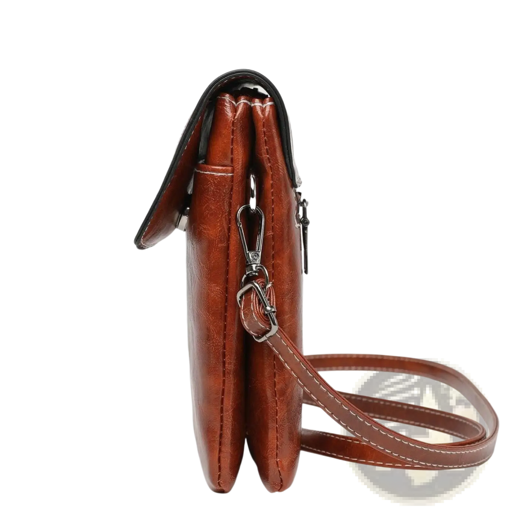 Brown faux leather floral and sunburst crossbody phone bag with black trim and silver-toned hardware