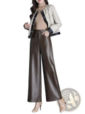 A sleek high waist brown faux leather wide leg pant with glossy finish and subtle creases for stylish wear