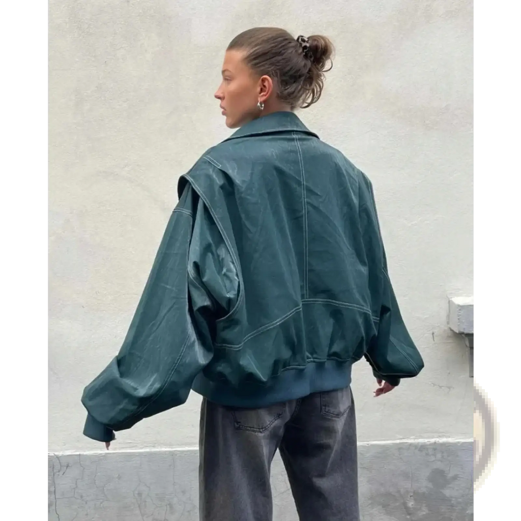 Dark teal faux leather streetwear jacket for women with exaggerated sleeves and contrasting white stitching