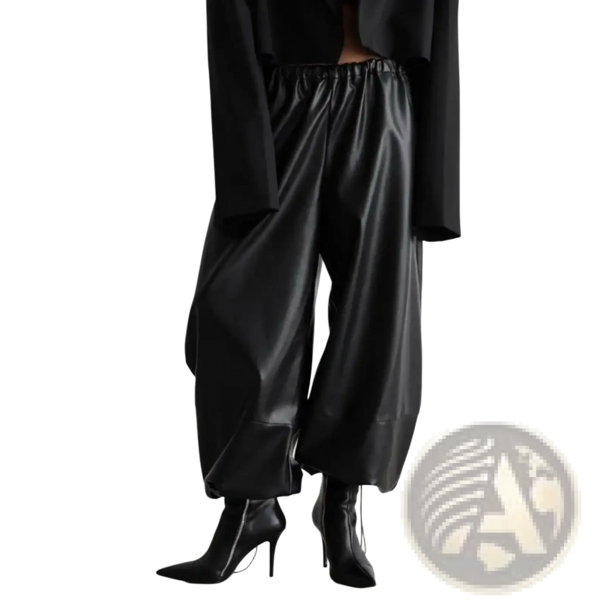 Black faux leather tapered pants with wide-leg design and elastic waistband for comfortable wear