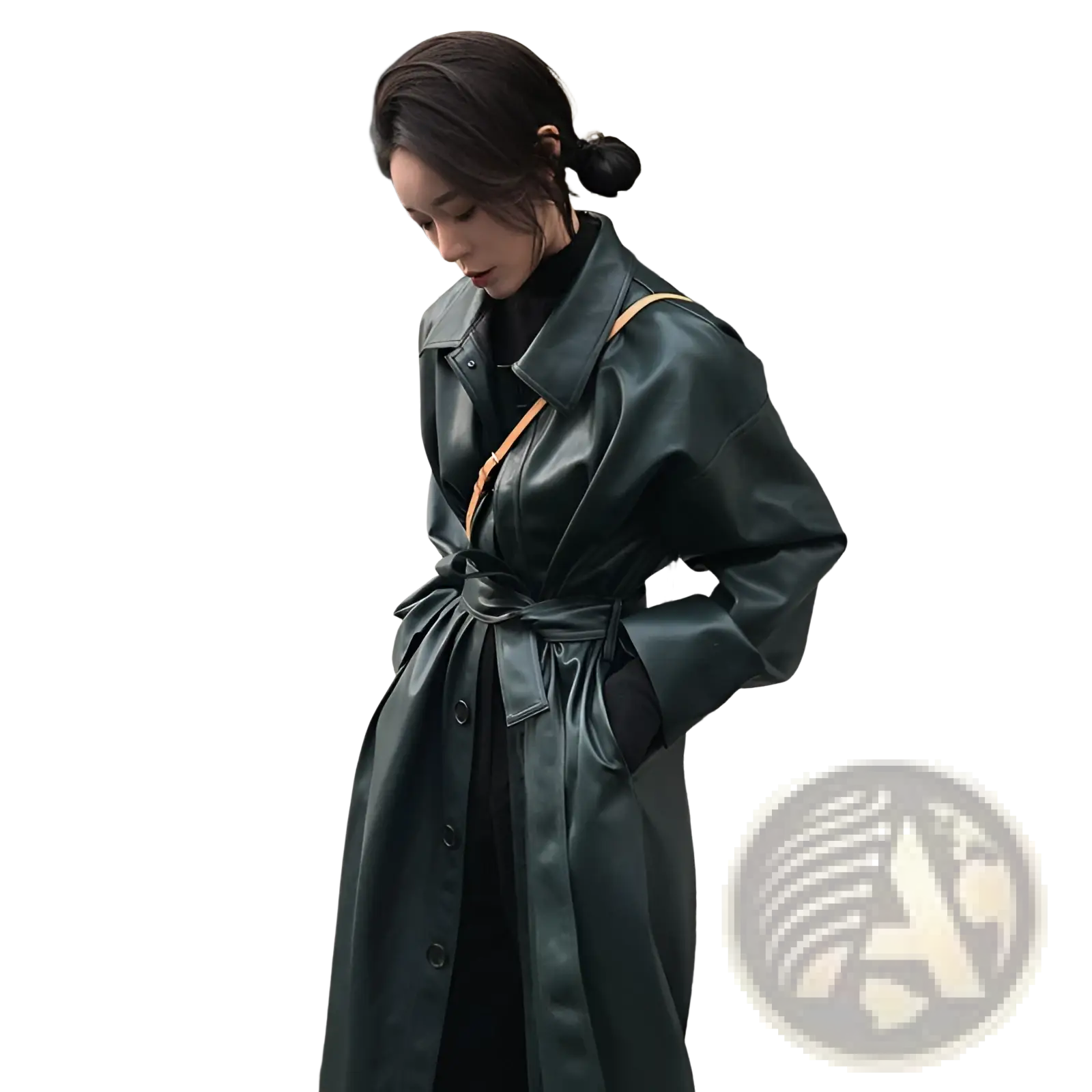 Dark green faux leather trench coat with belted waist and tan shoulder strap in a long windbreaker style