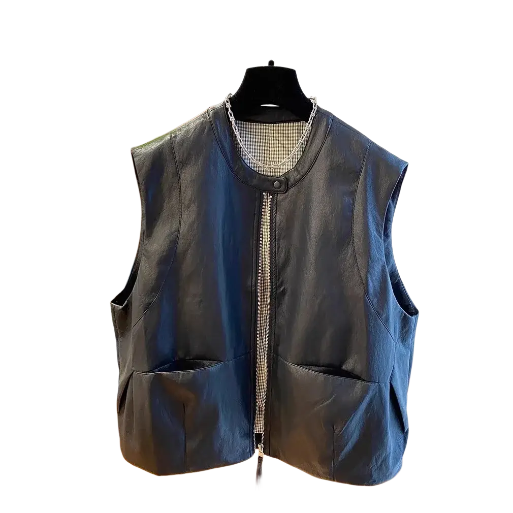 Black faux leather vest for women with zipper front, large patch pockets, and subtle checkered lining at neckline