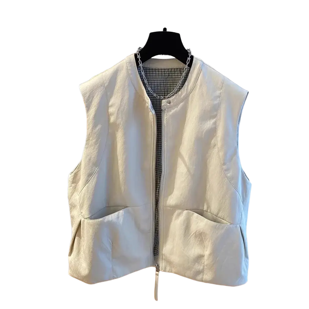 Cream-colored faux leather vest with front zipper and two large patch pockets for loose casual wear
